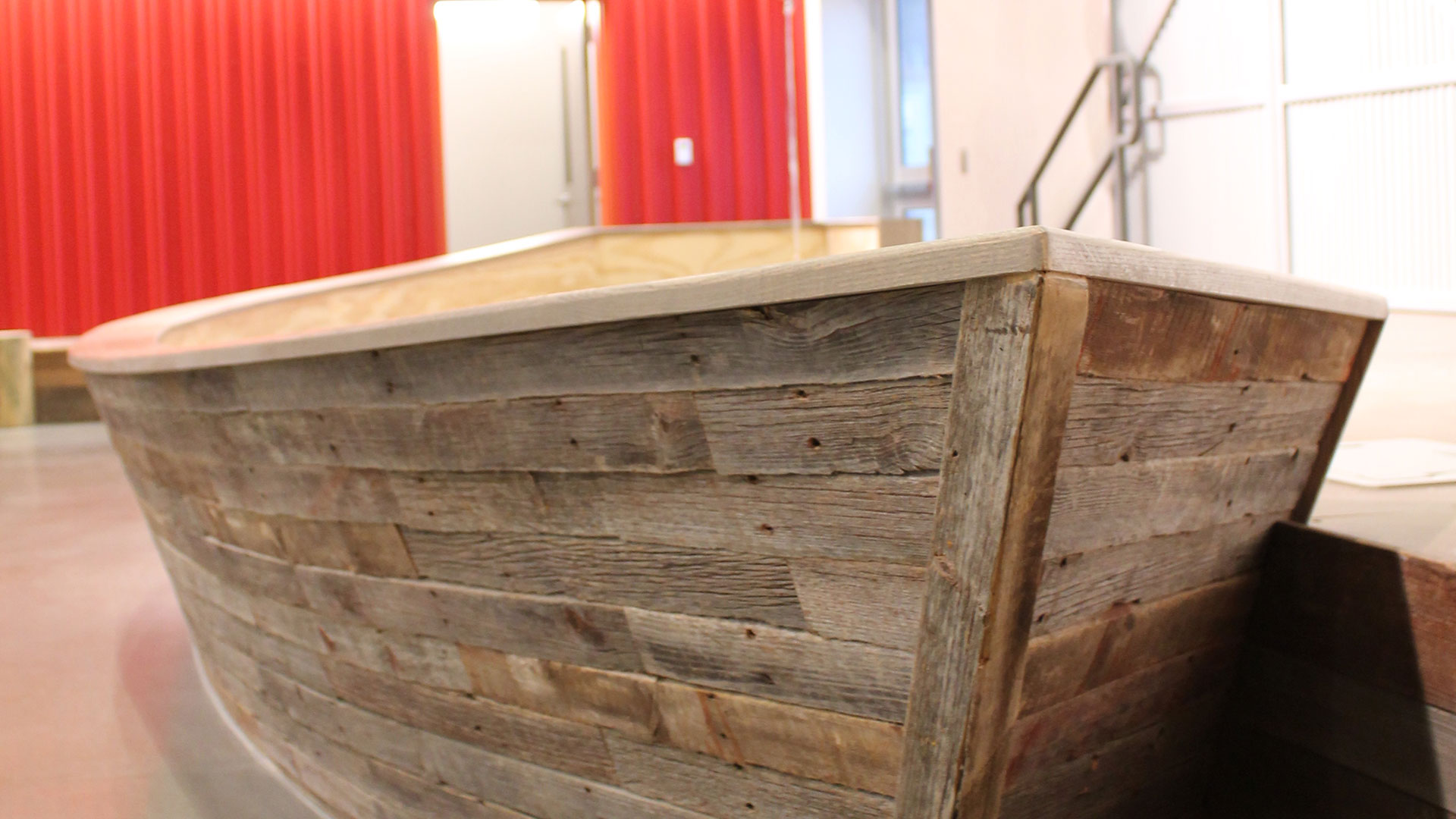 Reclaimed wood boat stage in WE Kids area at The Water's Edge Church in Omaha, NE